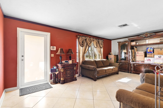 living room featuring light tile patterned floors and ornamental molding