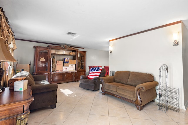 living room featuring light tile patterned floors and ornamental molding