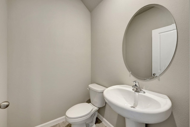 bathroom featuring sink and toilet