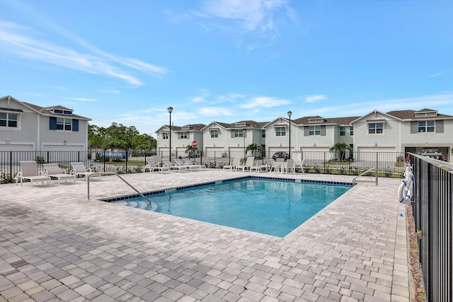 view of swimming pool with a patio area