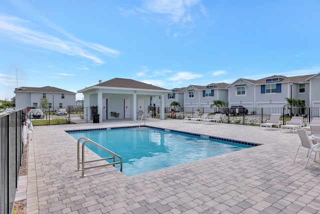 view of swimming pool with a patio