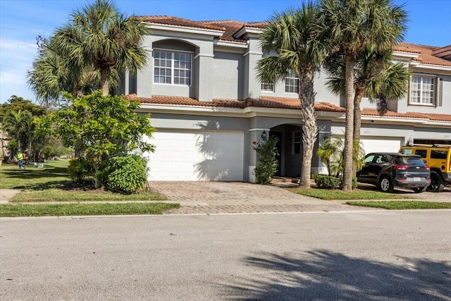 mediterranean / spanish-style house featuring a garage