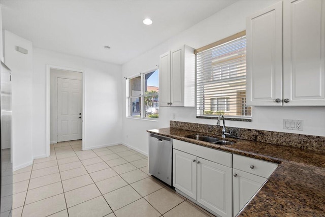 kitchen featuring dishwasher, white cabinetry, and sink