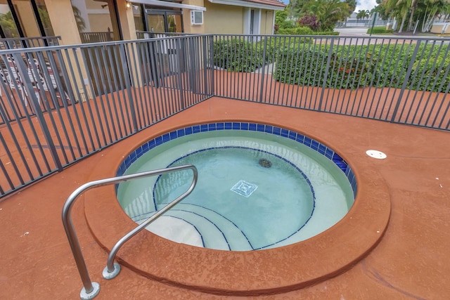 view of pool with a community hot tub