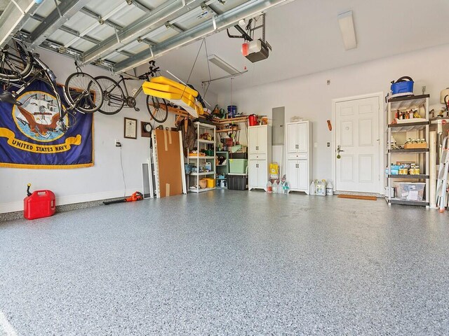 playroom with carpet and a drop ceiling