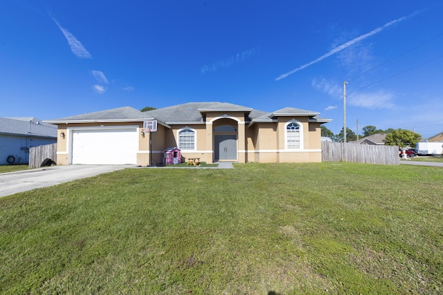 view of front of property with a garage and a front lawn