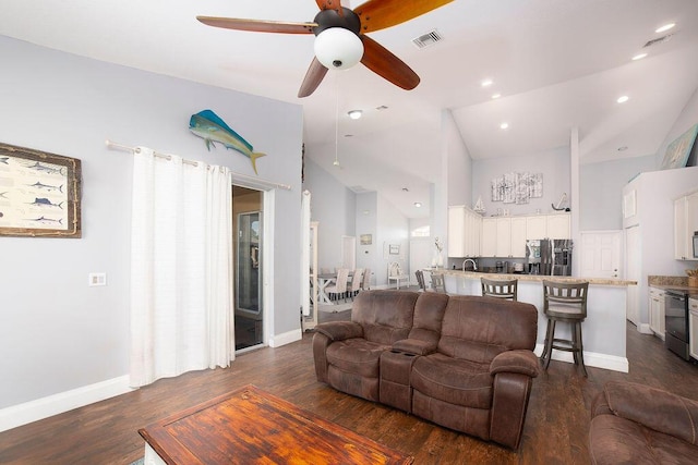 living room with high vaulted ceiling, ceiling fan, dark wood-type flooring, and sink