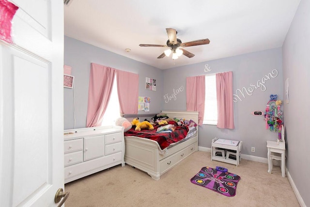 bedroom with light colored carpet and ceiling fan