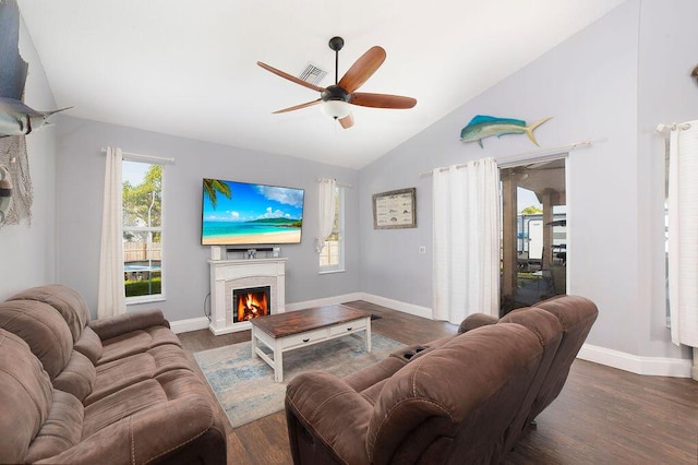 living room featuring ceiling fan, dark hardwood / wood-style flooring, and lofted ceiling