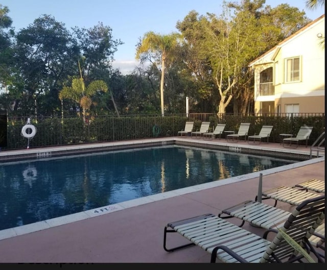 view of swimming pool with a patio