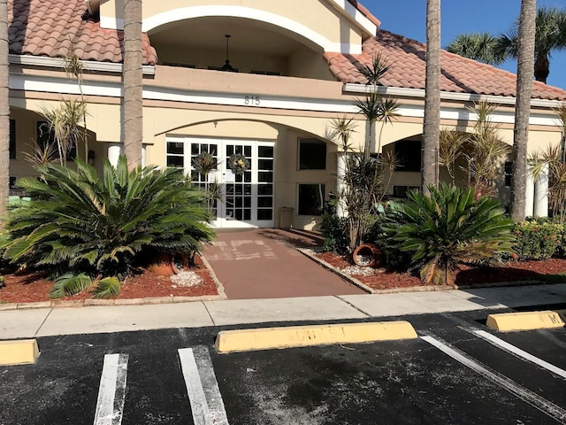 view of exterior entry featuring french doors