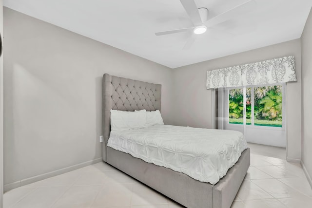 bedroom with light tile patterned floors, baseboards, and ceiling fan