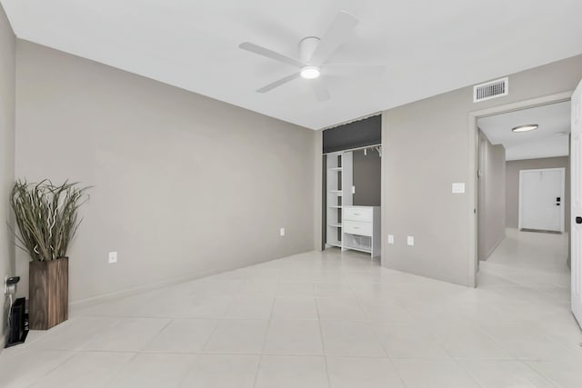 bedroom with light tile patterned floors, visible vents, baseboards, and ceiling fan