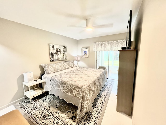 bedroom with ceiling fan and tile patterned flooring