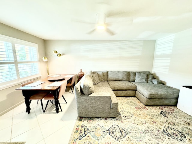 living room featuring tile patterned flooring and ceiling fan