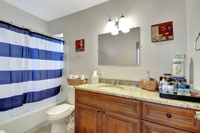 full bathroom featuring vanity, shower / bath combination with curtain, and toilet