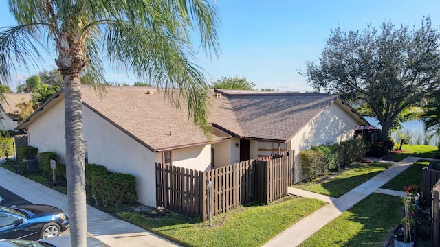 view of side of property with a yard