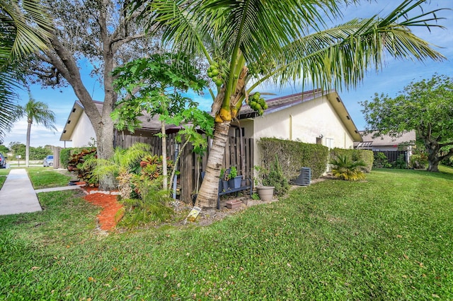 view of home's exterior with a yard