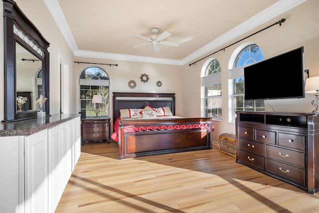 bedroom featuring light wood-type flooring, ceiling fan, and ornamental molding