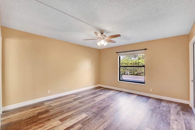 empty room featuring hardwood / wood-style floors, a textured ceiling, and ceiling fan