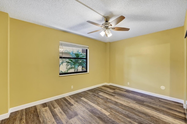 empty room with ceiling fan, hardwood / wood-style floors, and a textured ceiling