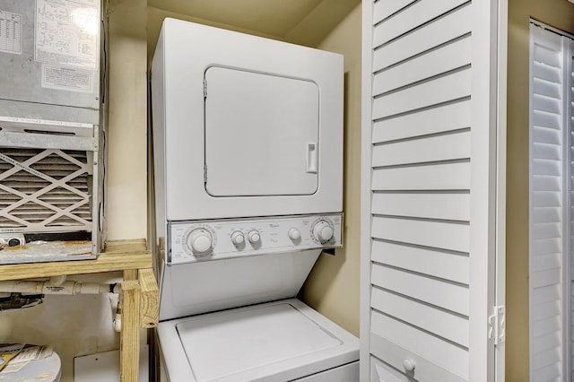 washroom with stacked washer / dryer