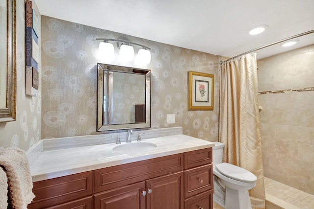 bathroom featuring curtained shower, vanity, and toilet