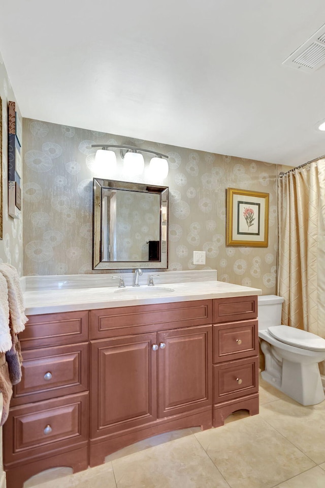 bathroom featuring tile patterned flooring, vanity, toilet, and a shower with shower curtain