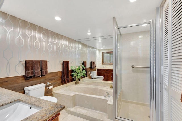 full bathroom with tile patterned floors, vanity, toilet, and independent shower and bath