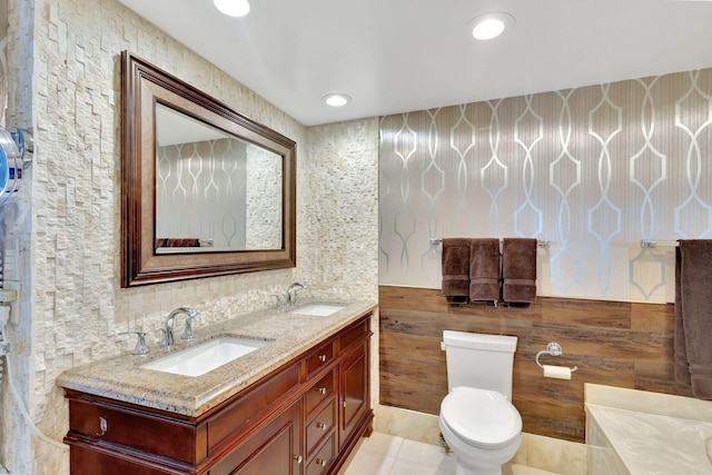 bathroom with tile patterned flooring, vanity, and toilet