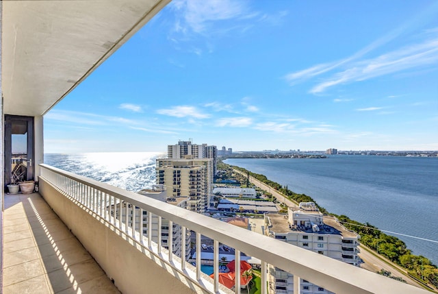 balcony featuring a water view