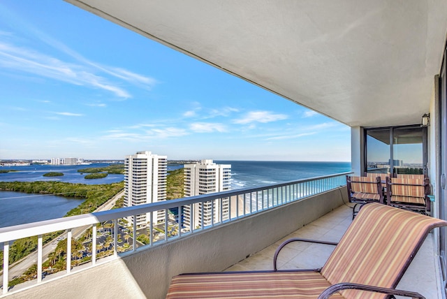 balcony featuring a water view