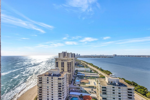 bird's eye view featuring a view of the beach and a water view