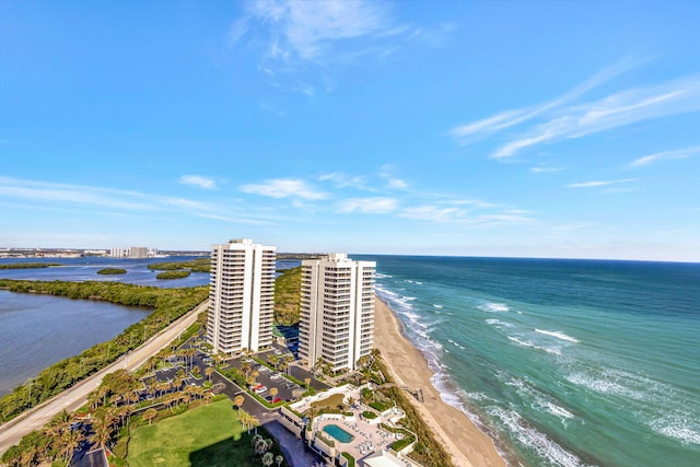 bird's eye view featuring a water view and a view of the beach