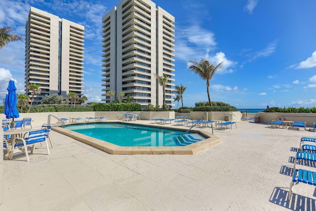 view of swimming pool featuring a patio area