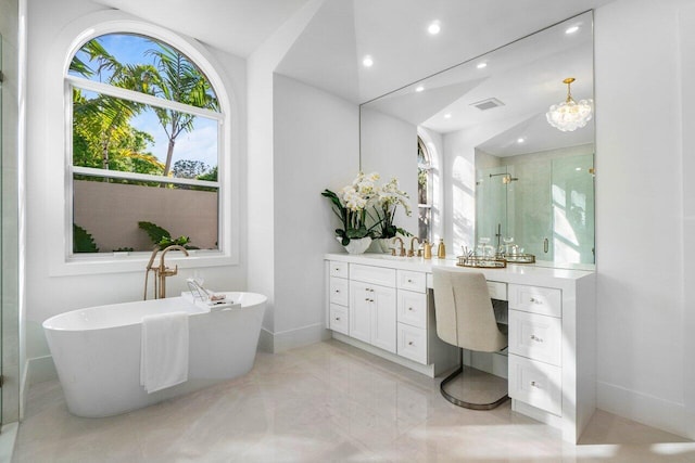 bathroom featuring vanity and plus walk in shower