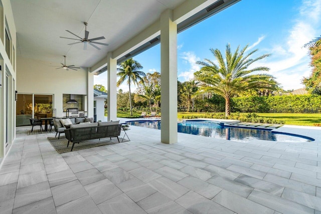 view of patio with a swimming pool with hot tub and an outdoor living space