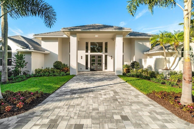 property entrance featuring french doors