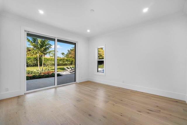 spare room featuring light hardwood / wood-style floors