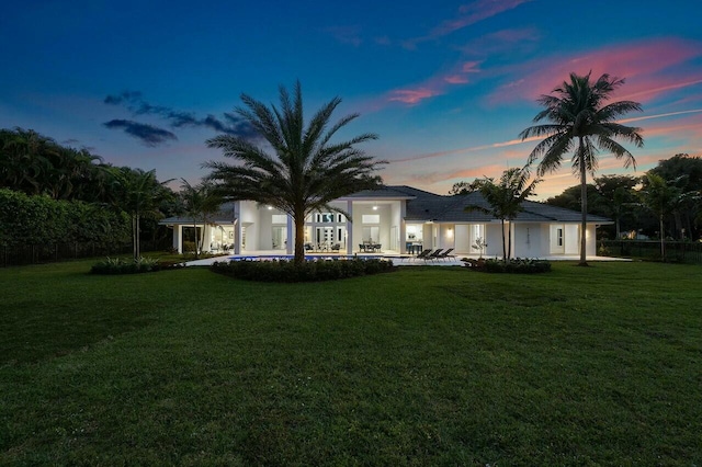 view of yard at dusk