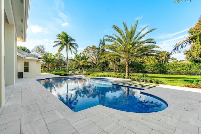 view of pool featuring a patio area and an in ground hot tub