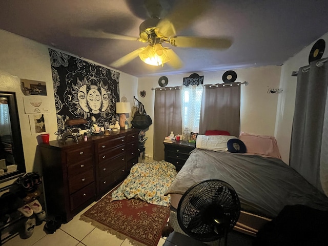 bedroom featuring light tile patterned flooring and ceiling fan