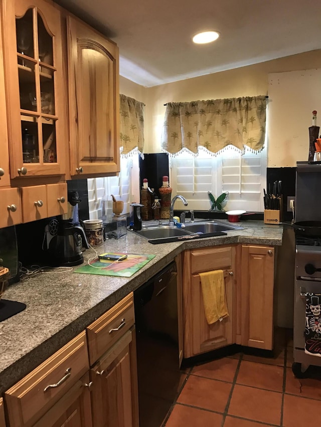 kitchen with sink, dishwasher, and light tile patterned flooring