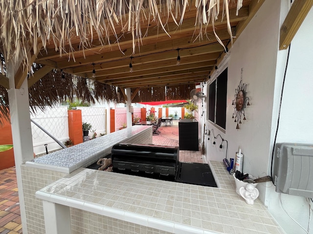 view of patio featuring a grill