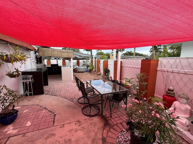 view of patio / terrace featuring an outdoor bar