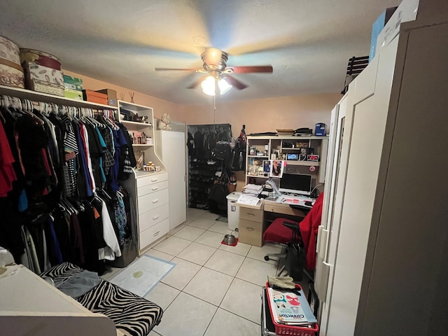 spacious closet featuring ceiling fan and light tile patterned floors