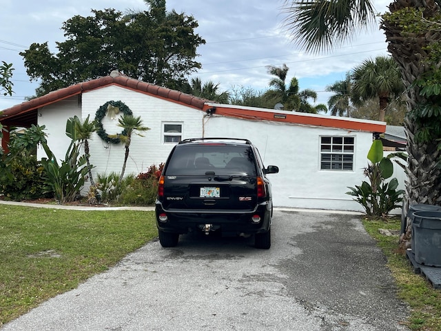 view of home's exterior with a yard