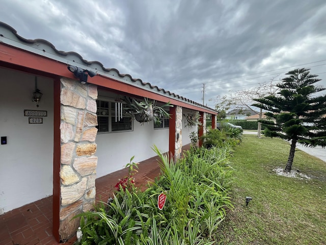 view of property exterior featuring a lawn