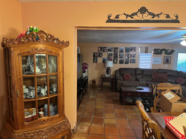 living room with dark tile patterned flooring