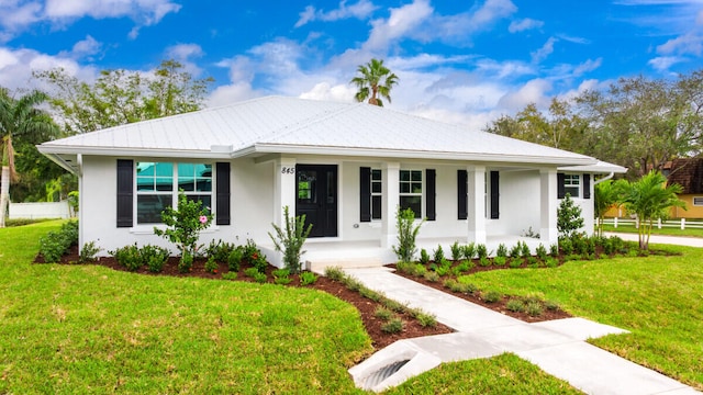 ranch-style home with a porch and a front lawn